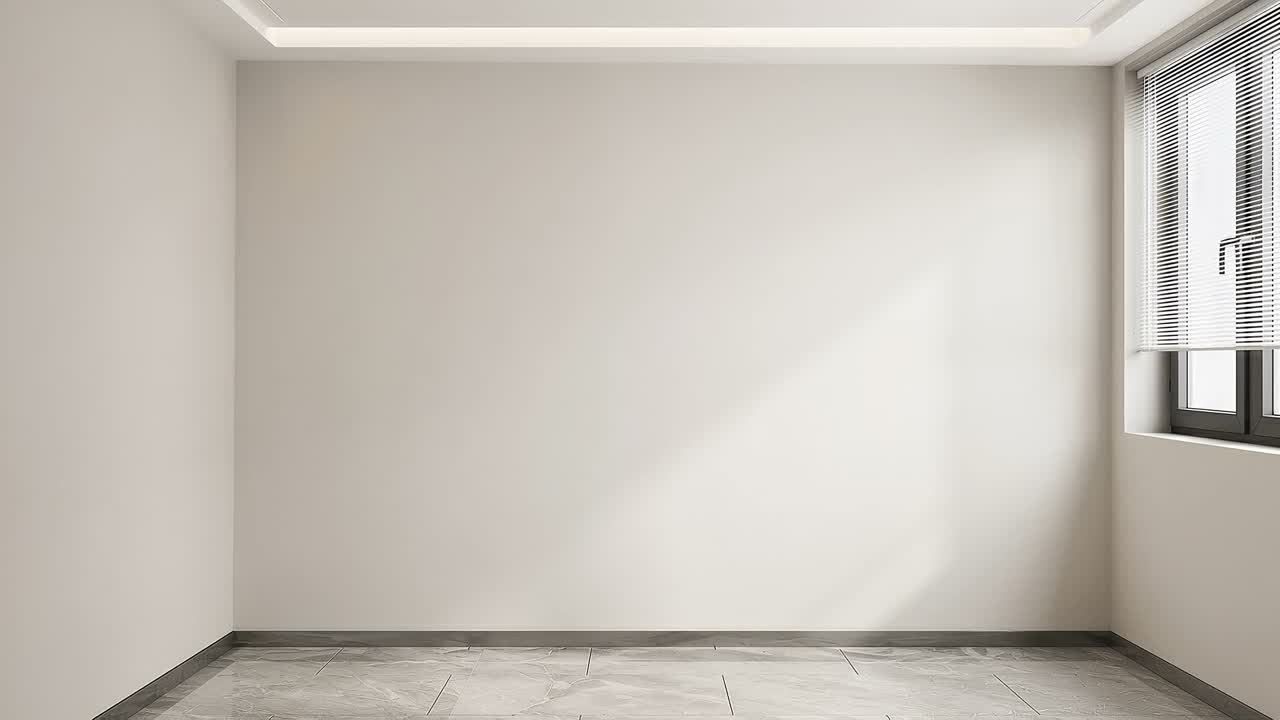 An empty architectural shell with a wide stone floor, white walls, and daylight entering through a window.